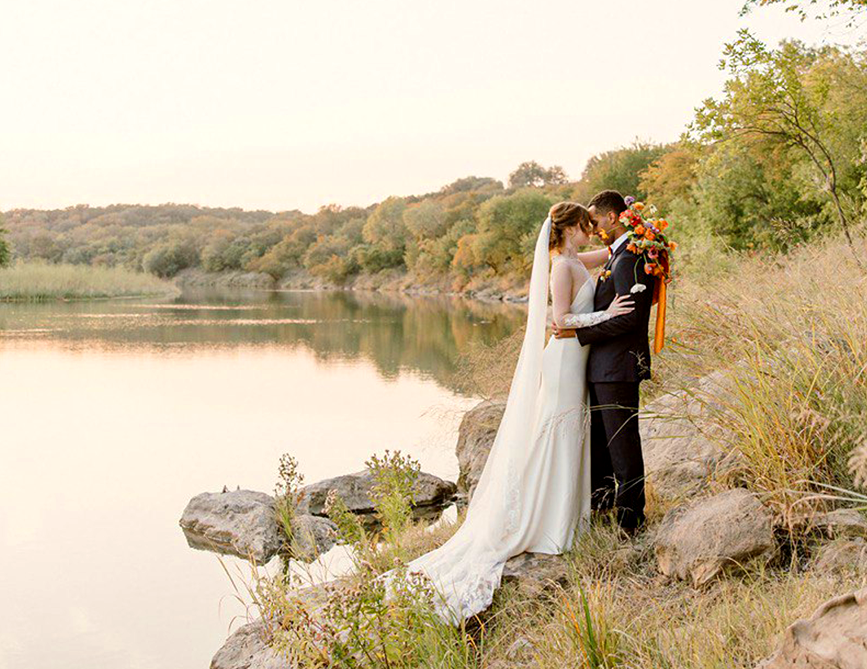wedding couple posing at the river